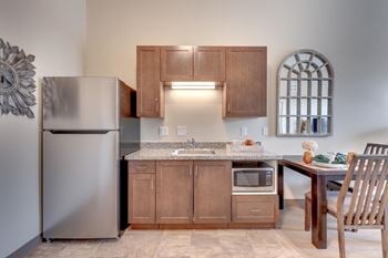 Kitchenettes with stainless-steel refrigerator and microwave